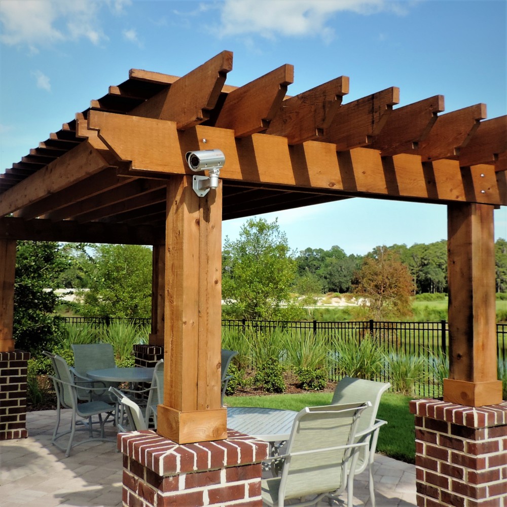 wood pergola made by Finyl Sales Inc on porch by river